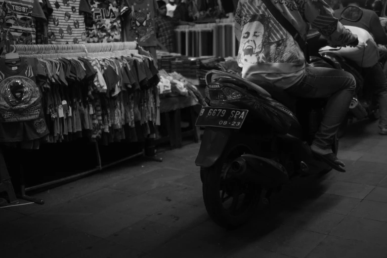 a person is sitting on a motor bike