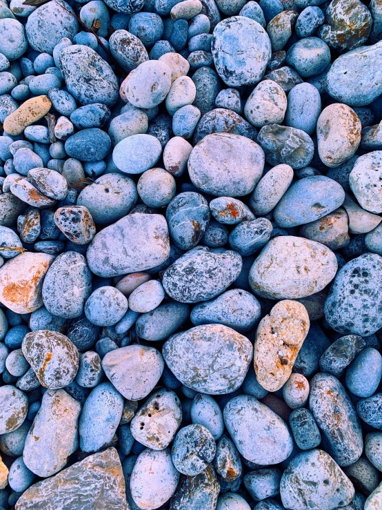 a gravel ground with many rocks on top