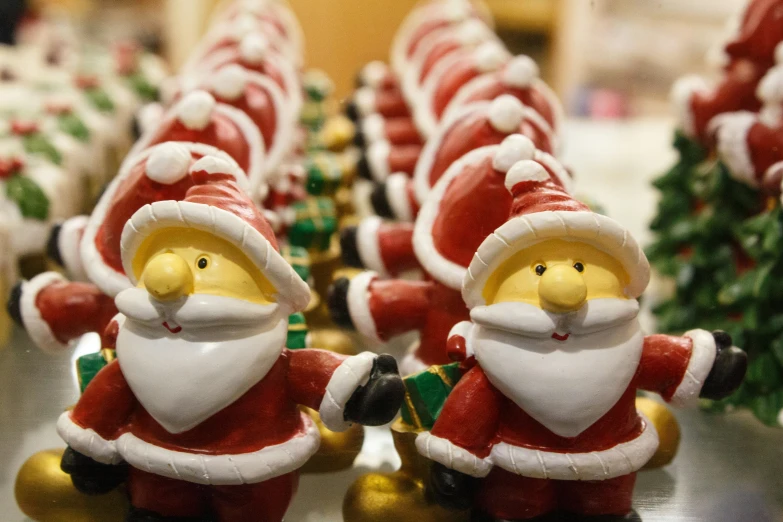 several simpsons christmas figurines are lined up