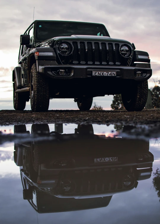 a black jeep parked on the side of a road