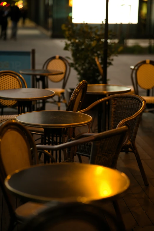 a bunch of tables and chairs are sitting outside