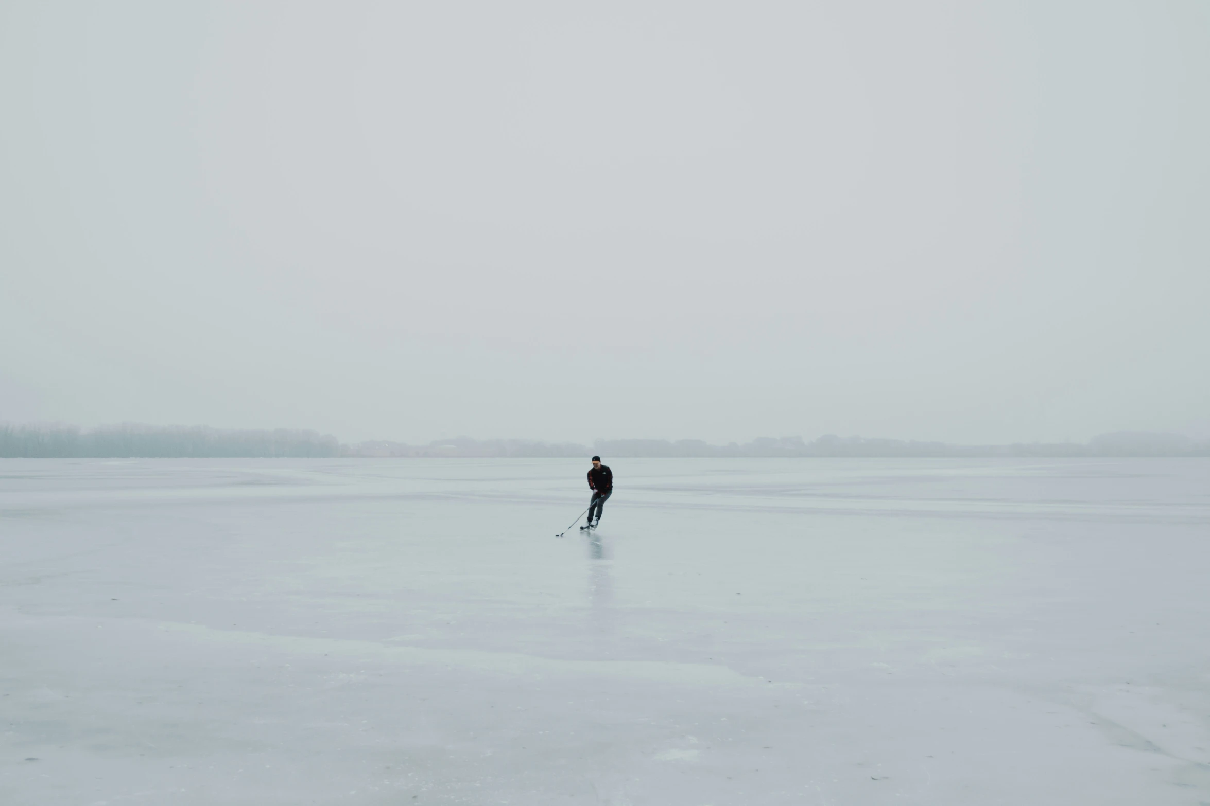 a person standing in the middle of a large expanse