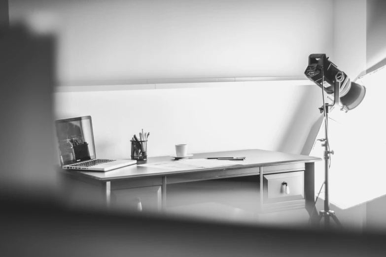 a desk in a room with a camera next to it