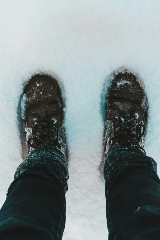 there is a person standing in deep snow