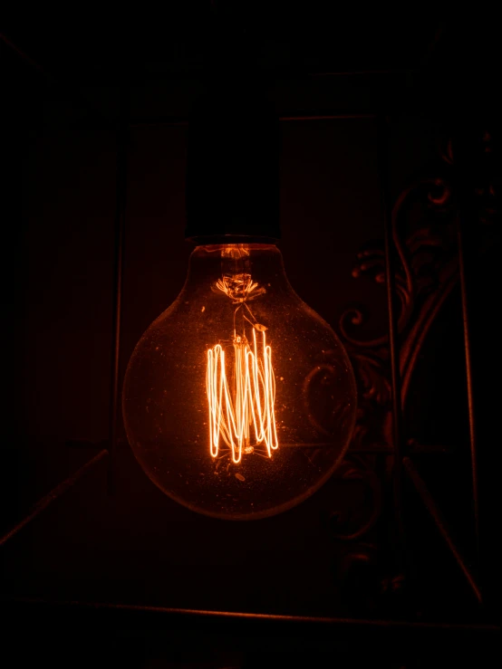 the light bulb is on and glowing in the dark