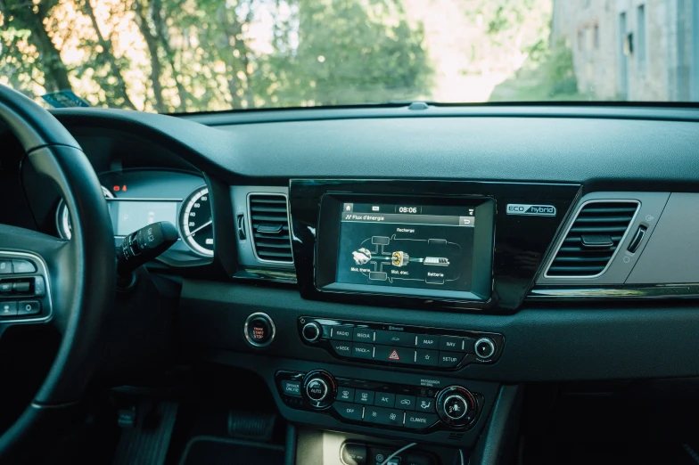 the dashboard and instrument of a car in the daytime