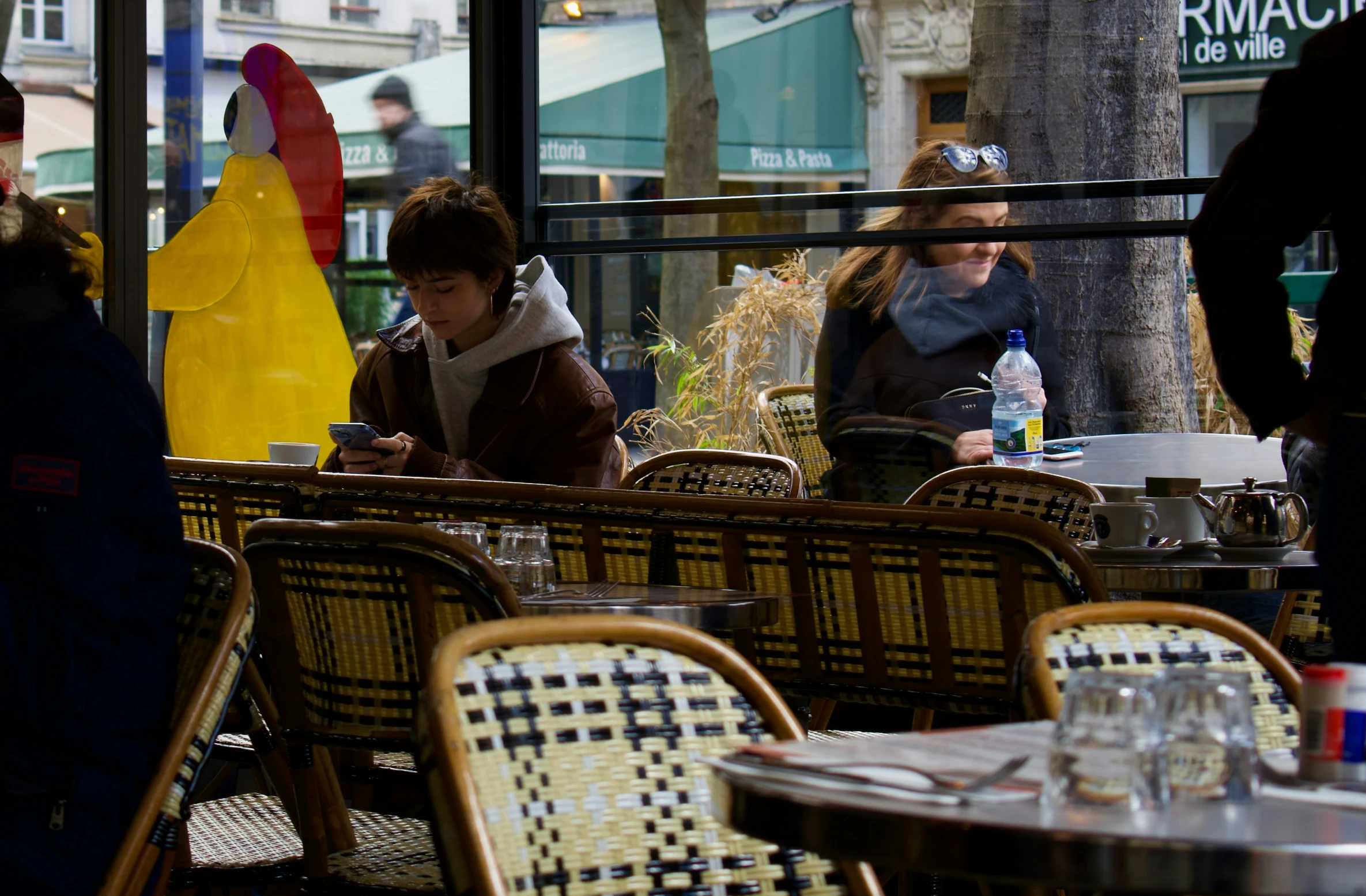 a group of people sitting in chairs outside