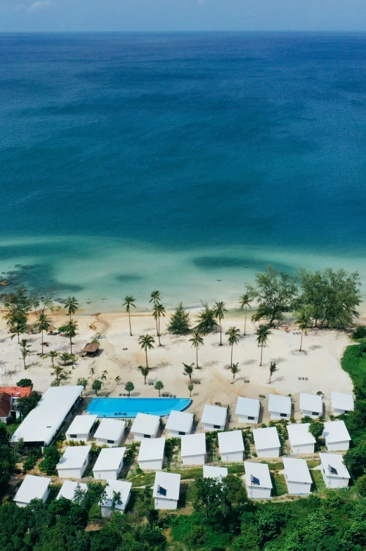 an aerial view of a beach and water area