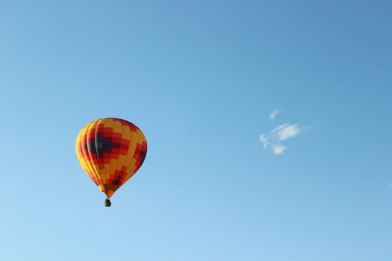 a balloon is flying high in the air