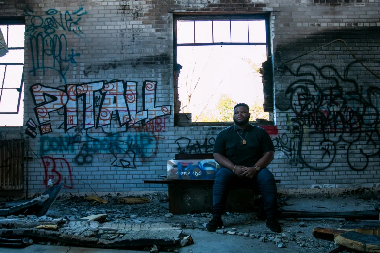 a person is sitting in a destroyed out building