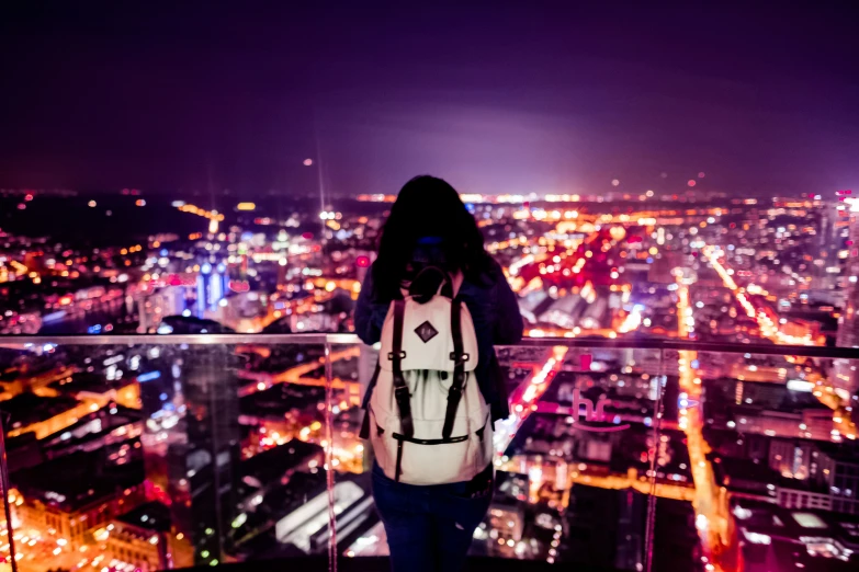 a person that is looking at a view at night