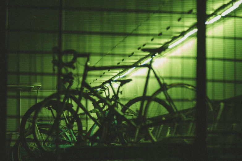 several bikes parked next to each other under a roof