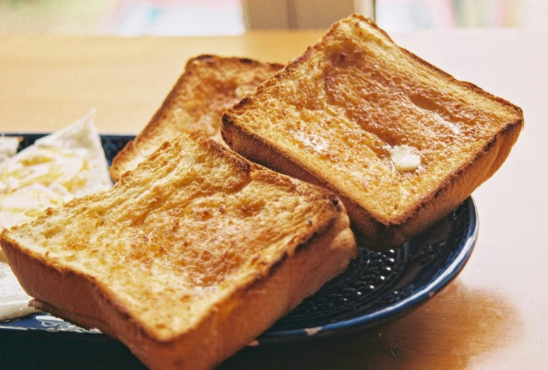 two pieces of toast sitting on a plate