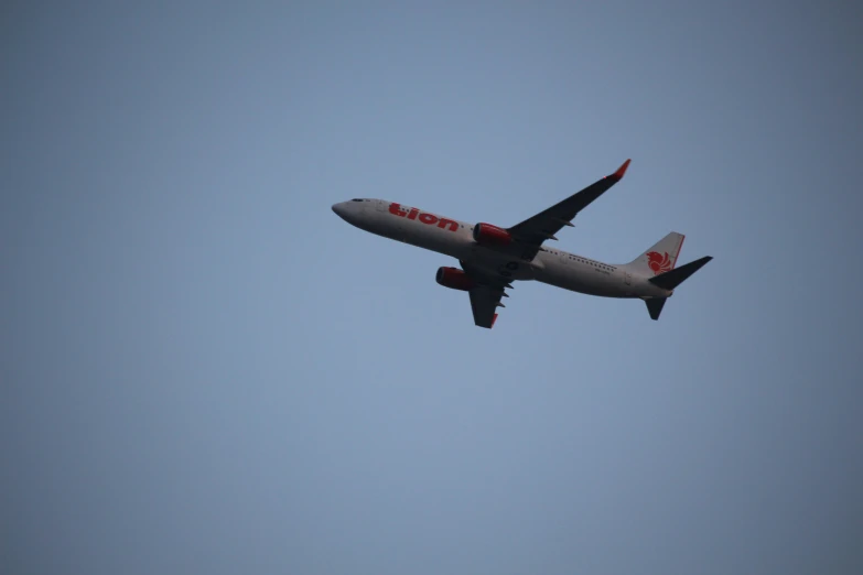 a jet airplane in the sky on a clear day