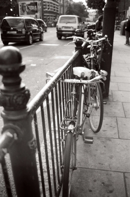 two parked bikes on the side of the road