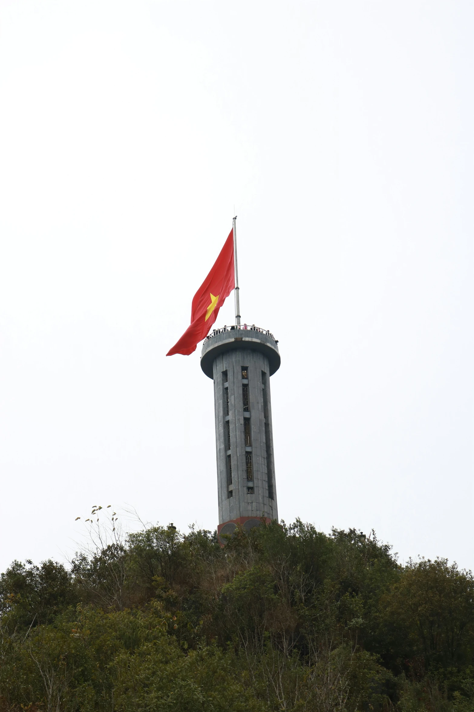 a flag flying on top of a building