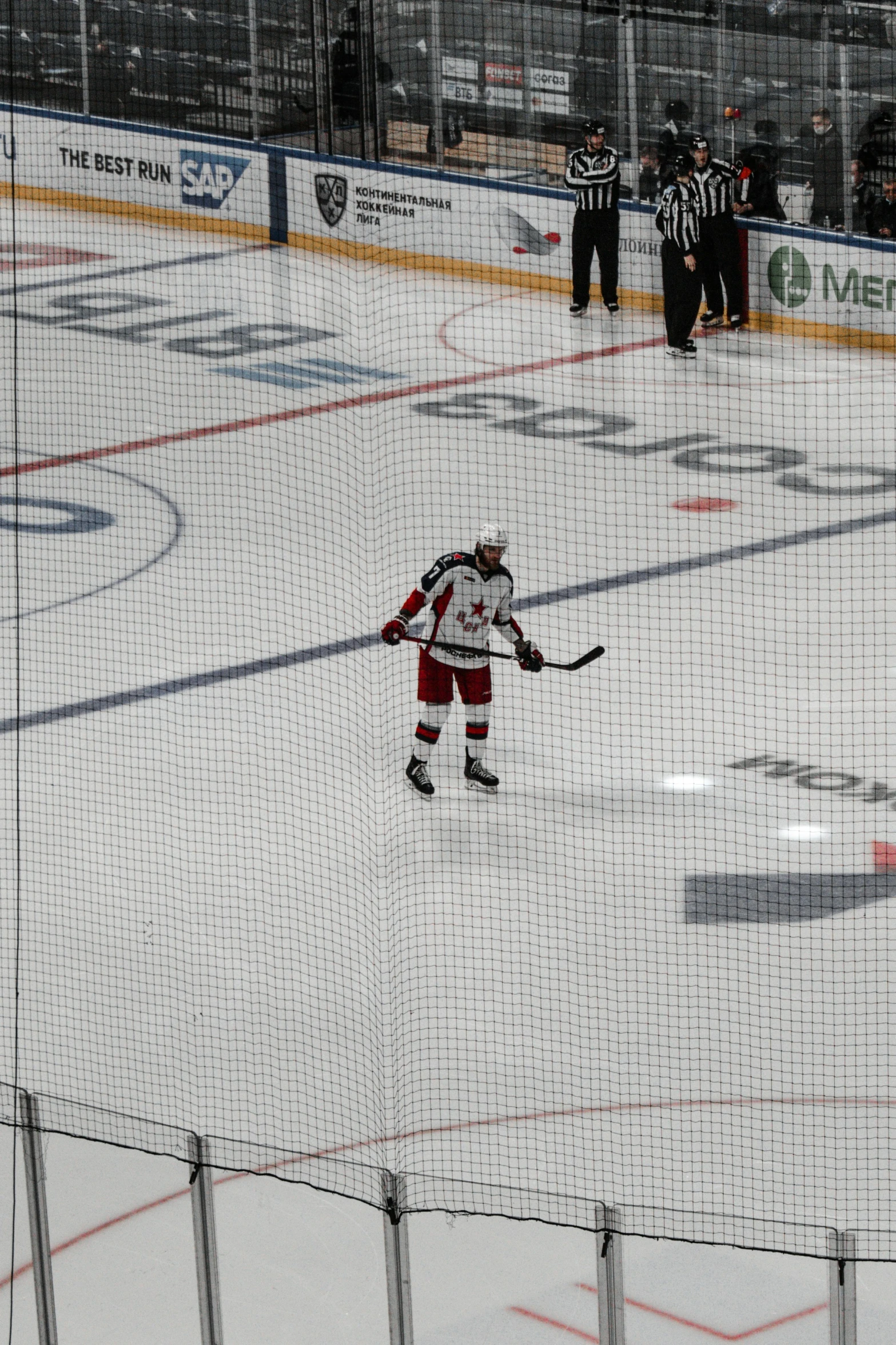 a hockey player playing in the ice with sticks