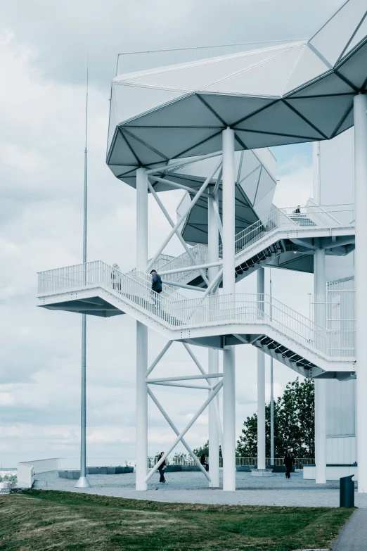 a tall building has a walkway going up it