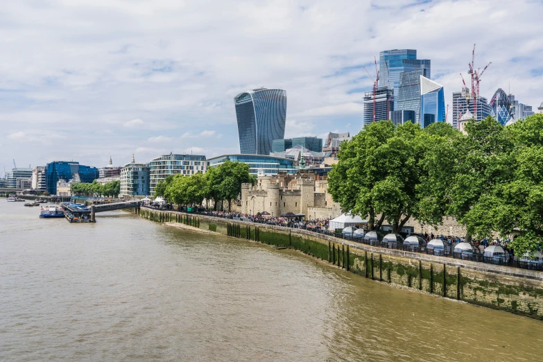 a river runs alongside the city skyline