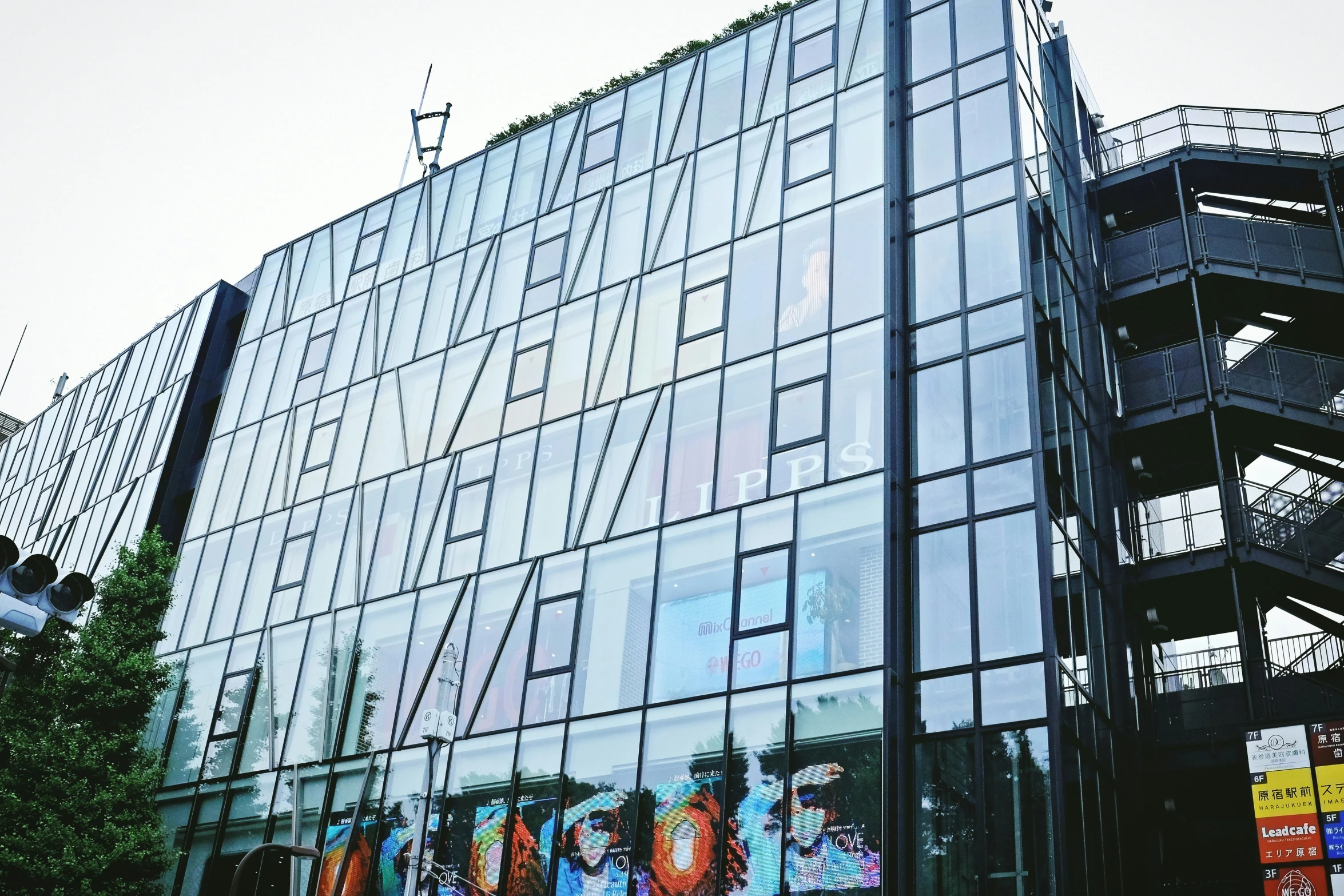 many signs and a building have been designed like glass