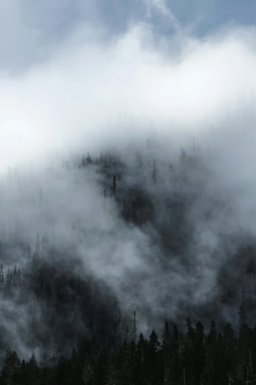 mountain shrouded in mist on a clear day