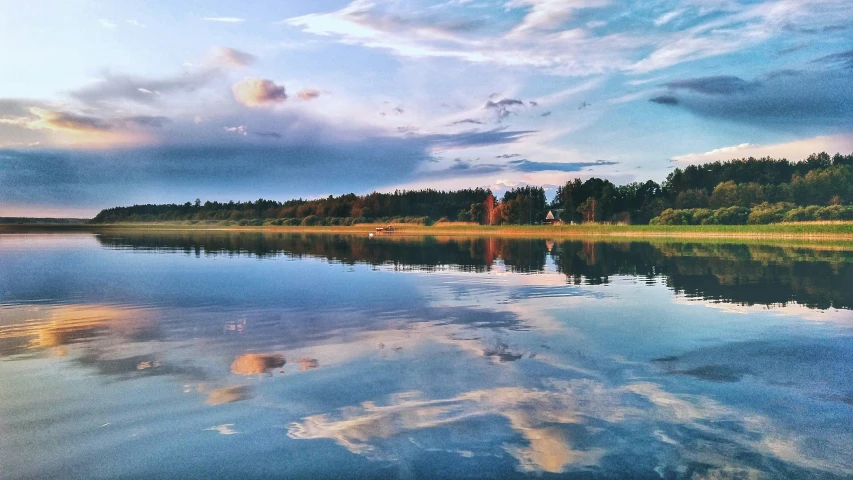 an image of a lake with trees on the side