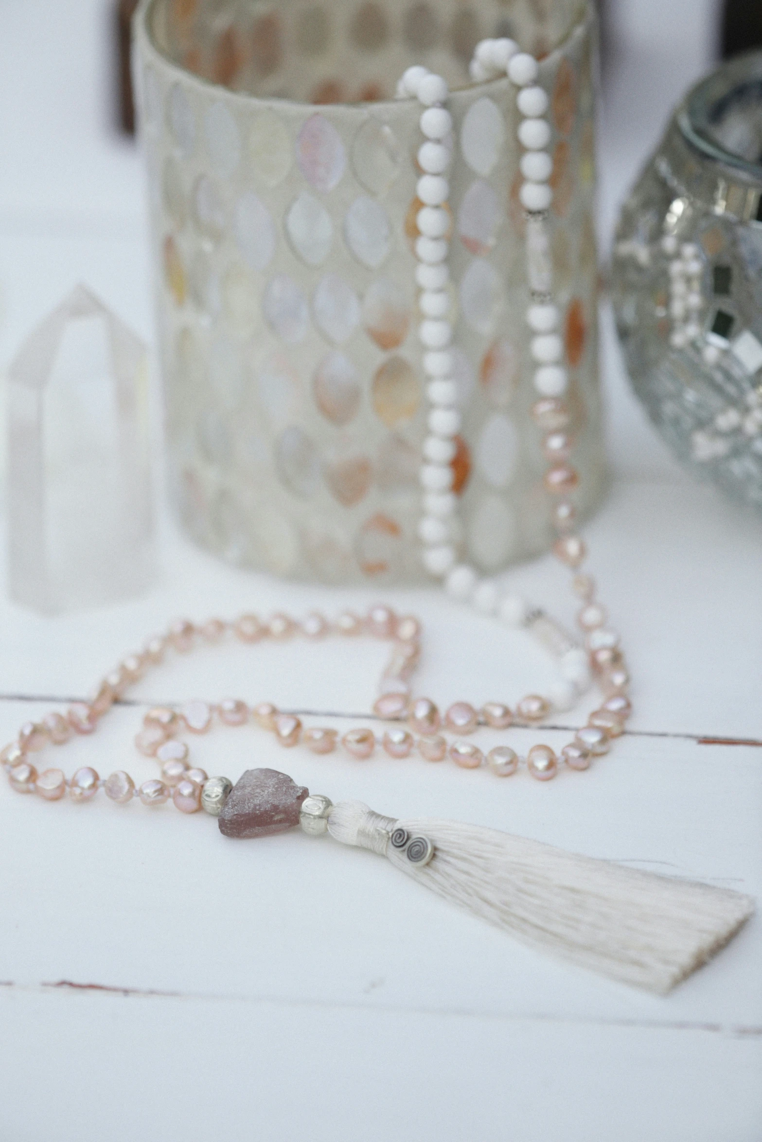 this is an image of a beaded and tassel necklace