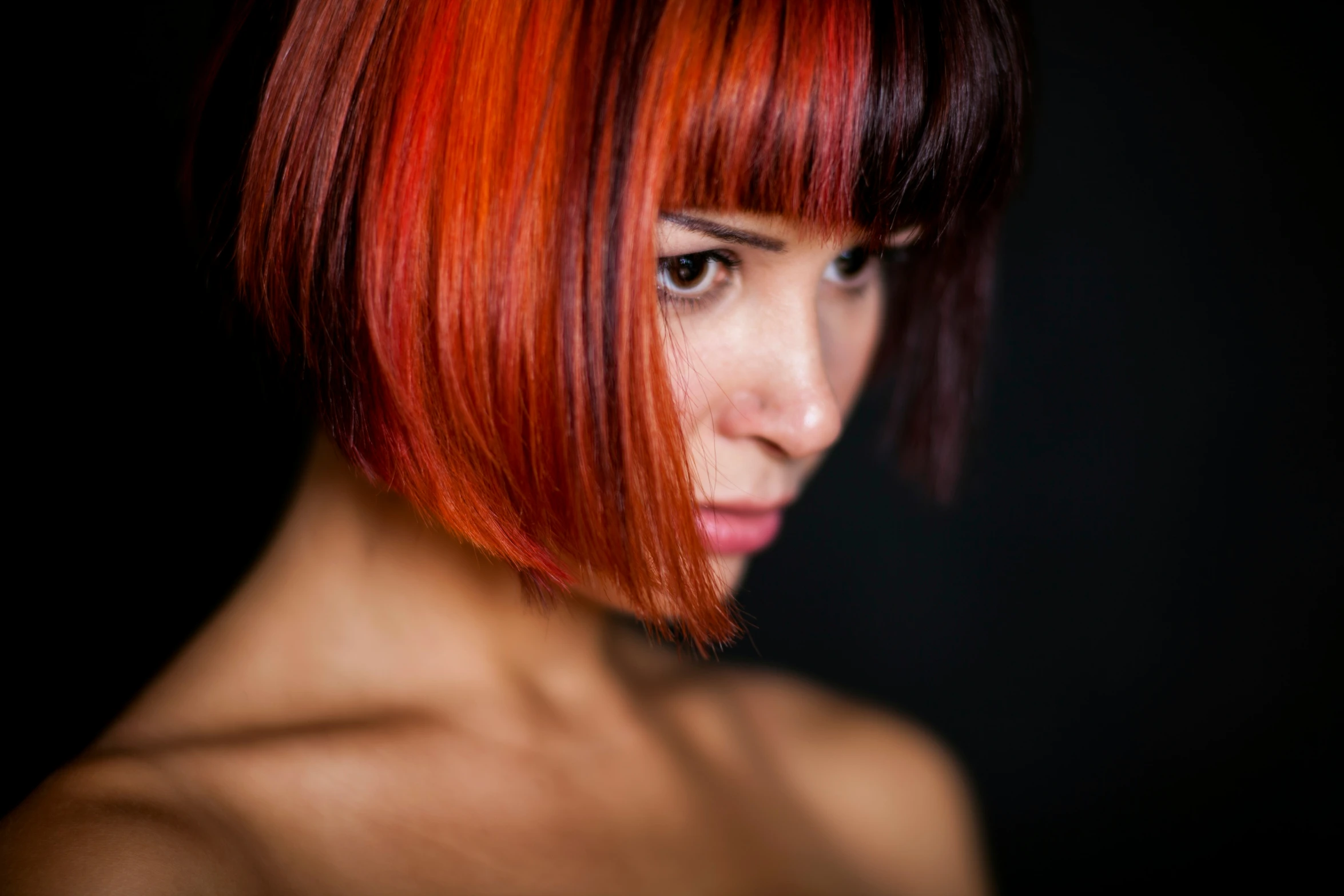 a red haired woman with red hair and bangs