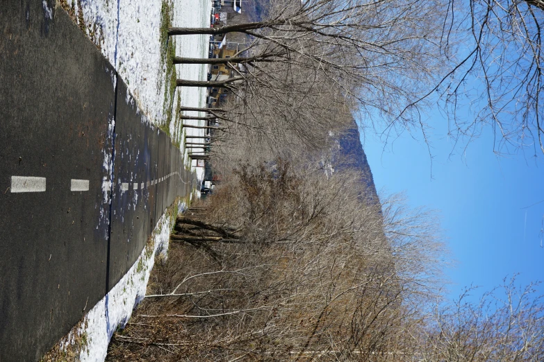 view looking down the road toward a steep hill