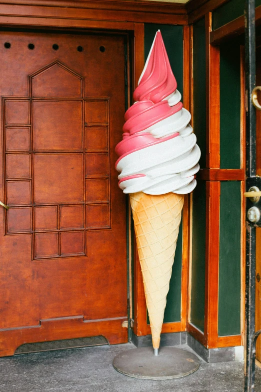 a close up of a ice cream cone on the ground