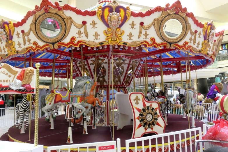 a brightly painted carousel at the carousel museum