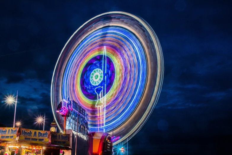 a spinning wheel at a carnival at night