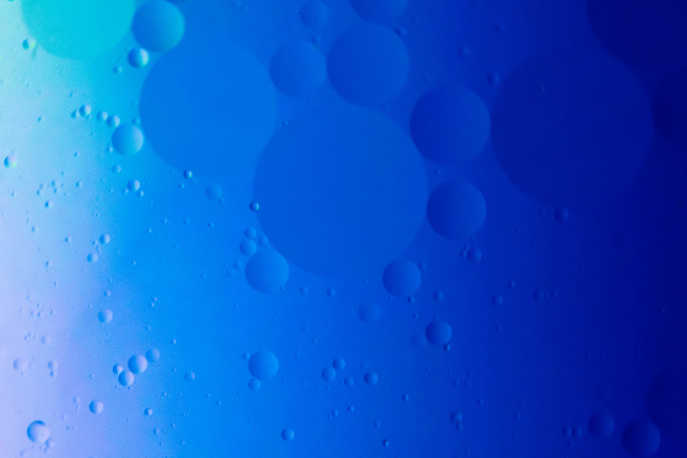 some bubbles in water with some blue sky in the background