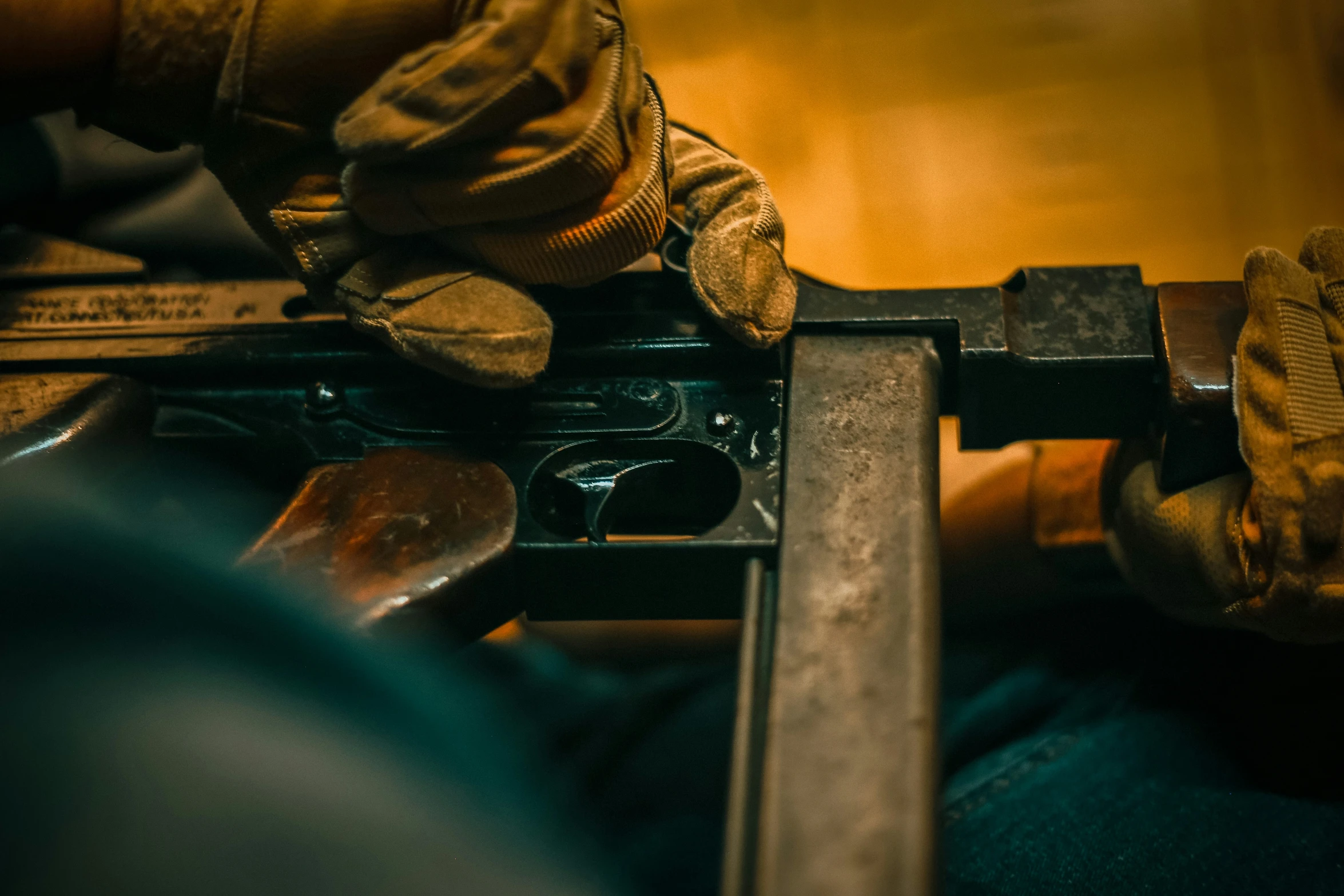 hands that are on a tool holding a wrench