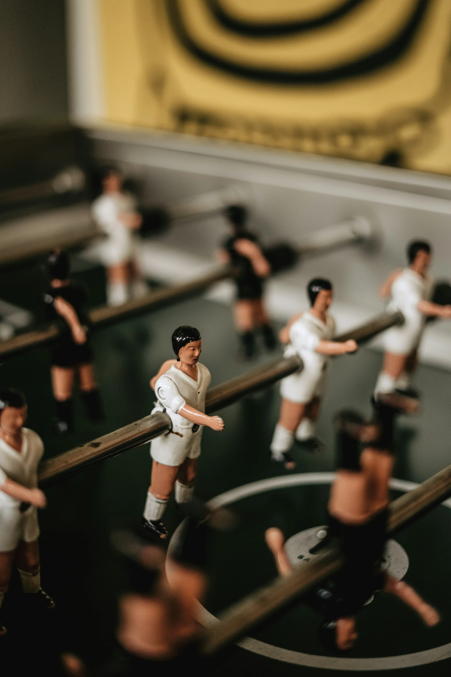 a small group of figurines standing on top of metal bases