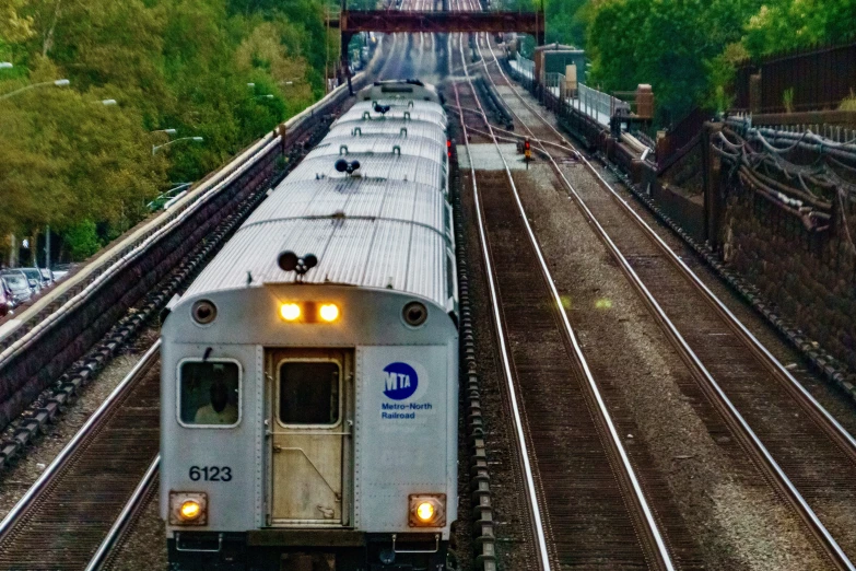 an empty train station with a passenger train