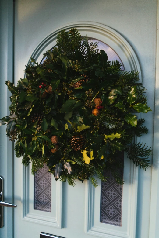 a wreath on the front door of a house