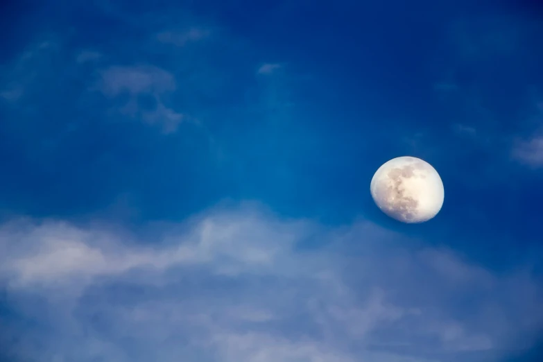 an airplane flying across the sky with an eclipse