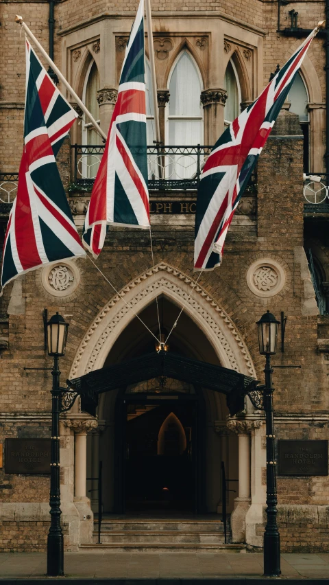 a gate that is outside with flags on it