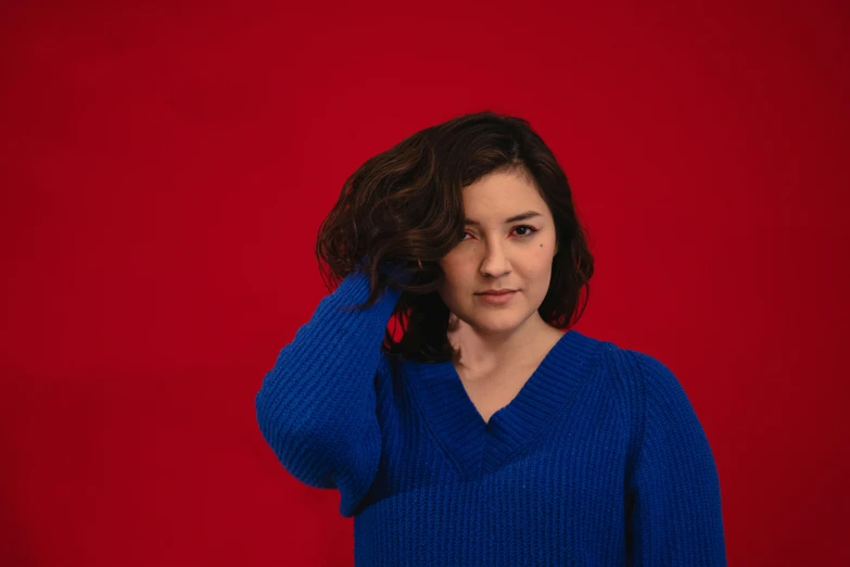 the woman has curly hair in the studio