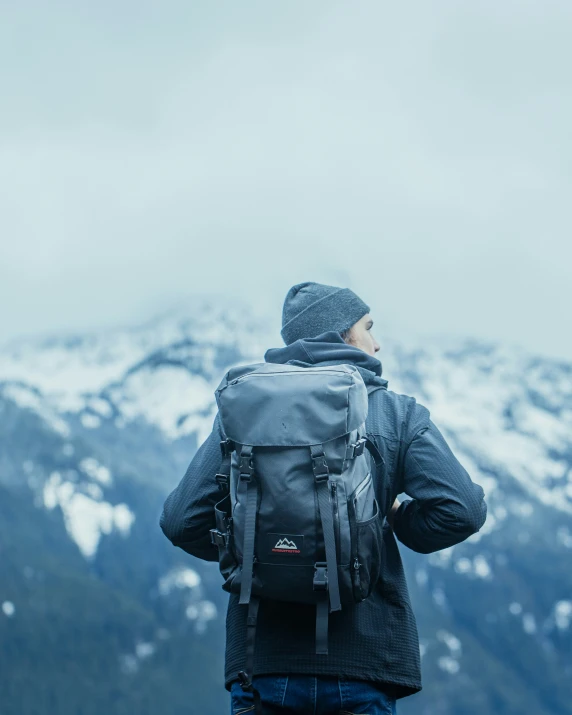 a person standing with his back to the camera