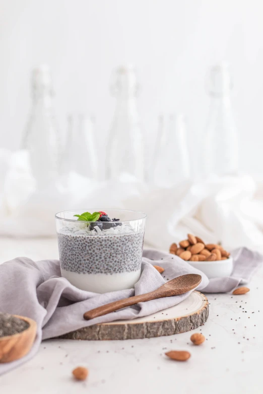 an almond and chia ding served in bowl next to spoon