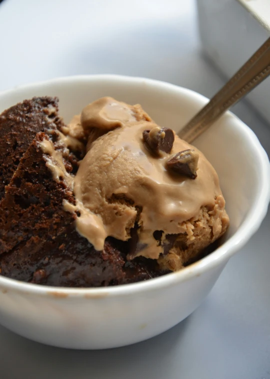 there is a bowl that has ice cream and chocolate