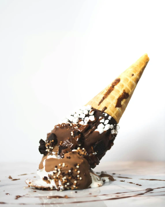 a very strange looking cone has been made out of ice cream and cookies