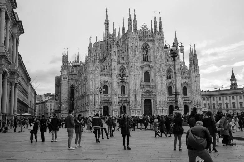 group of people in front of a cathedral