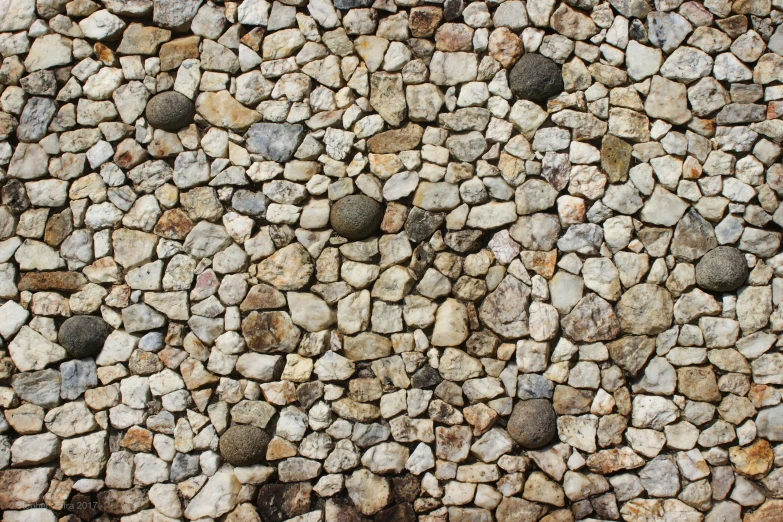 the rock walls are made out of rocks and gravel