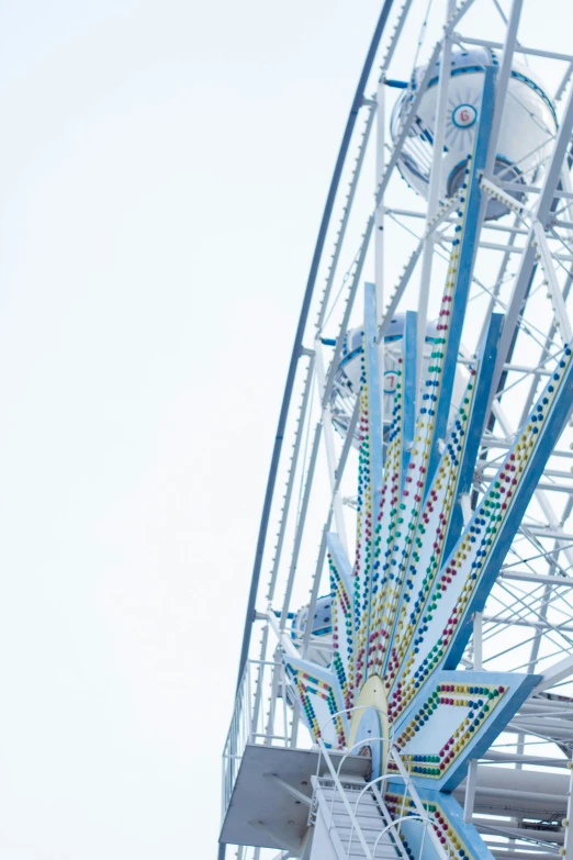 large white ferris wheel on the side of the building