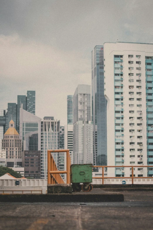 the side of a building with some tall buildings in the background