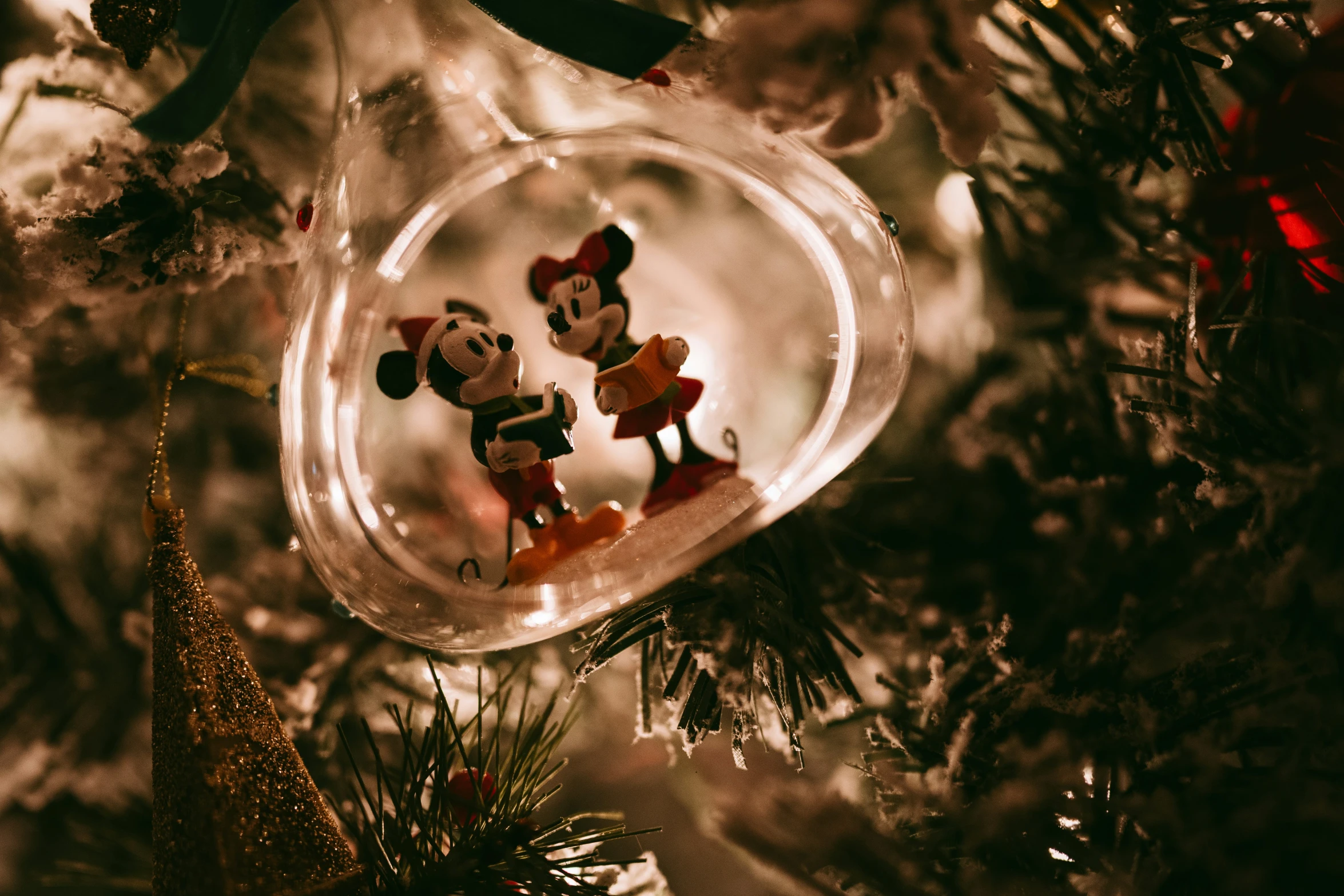 a glass ornament that is on the tree