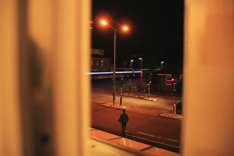 an outside view of a person walking in front of a window